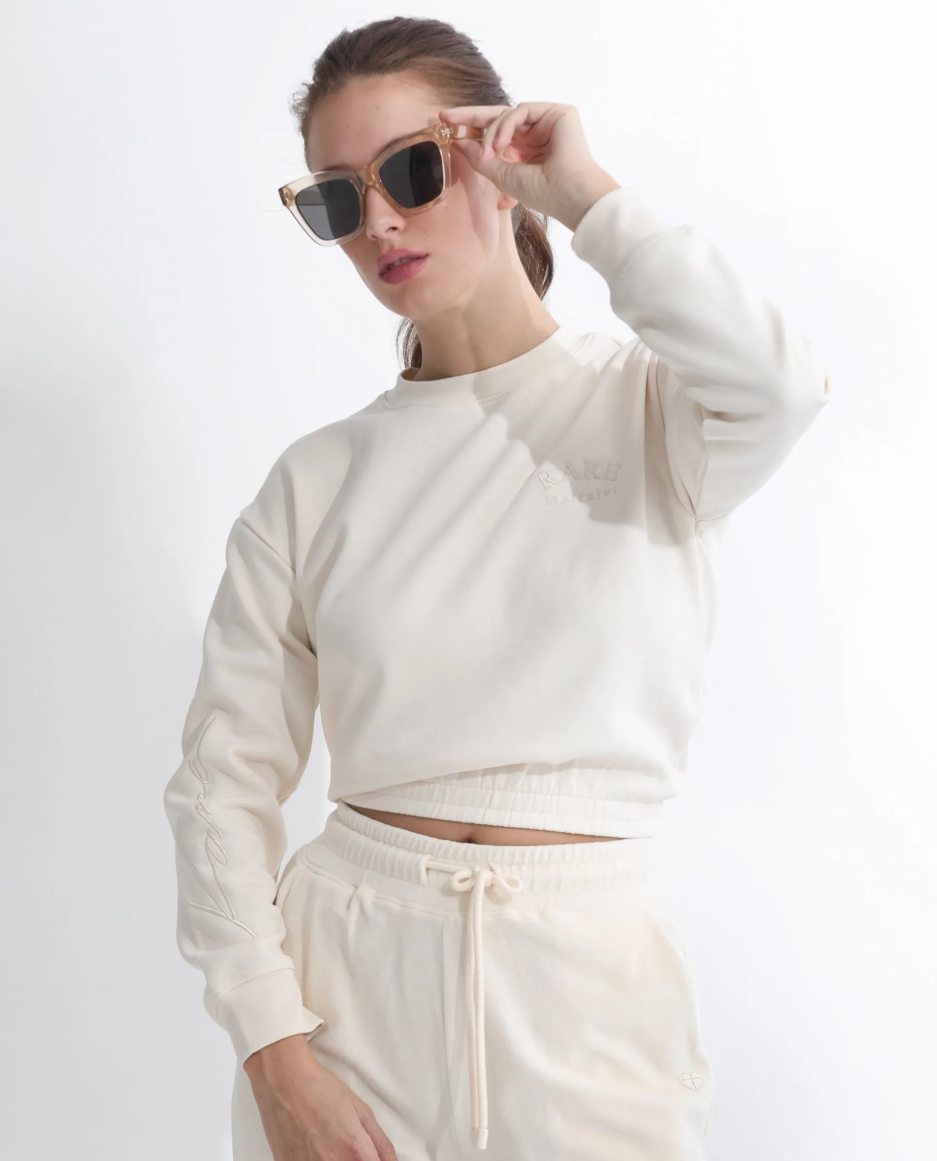 Rareism Articale Women Krok Beige Poly Cotton Fabric Full Sleeves Cuffed Sleeve Round Neck Regular Fit Plain Cropped Sweatshirt